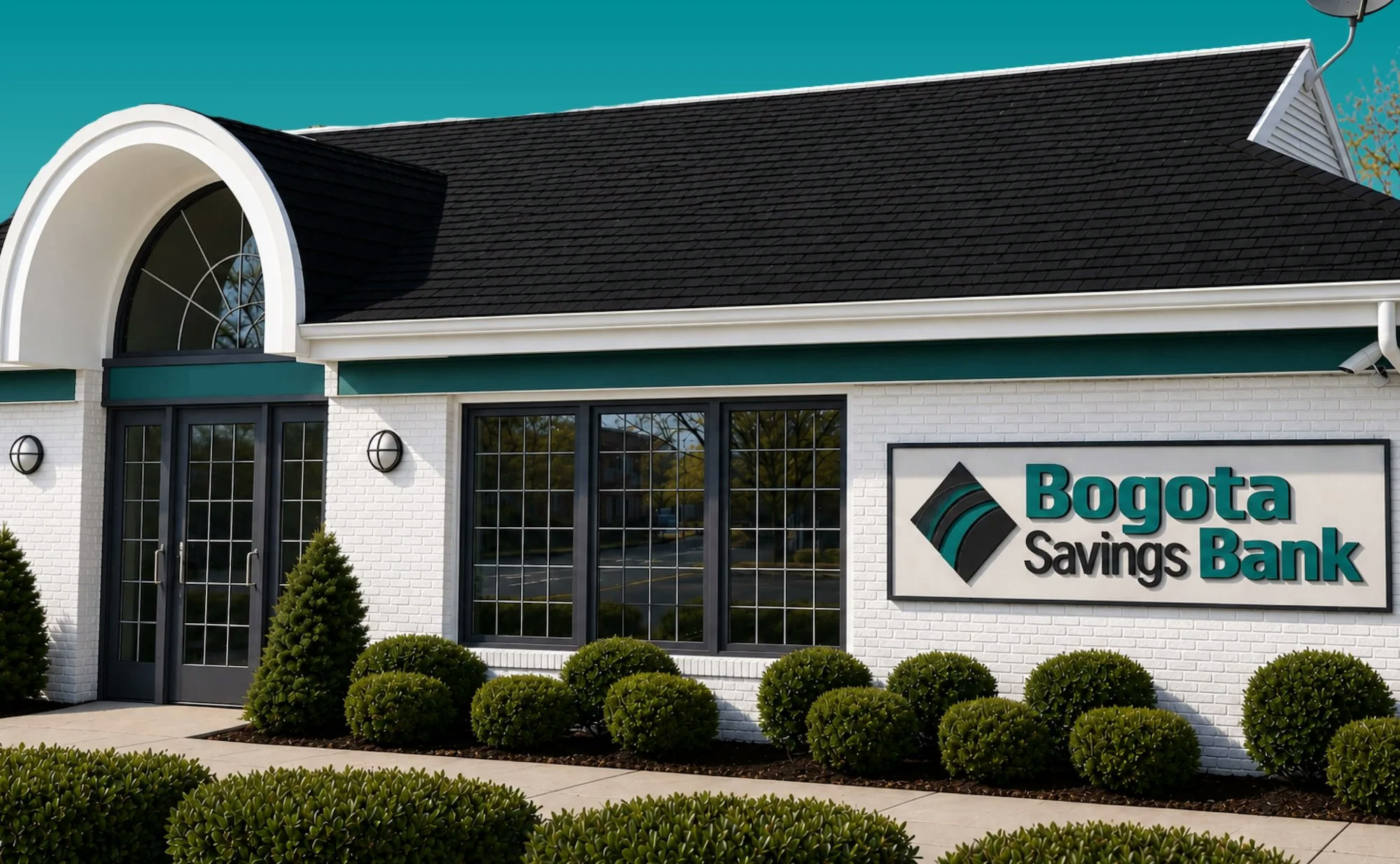Exterior of a Bogota Savings Bank branch with an arched entrance and the bank's sign